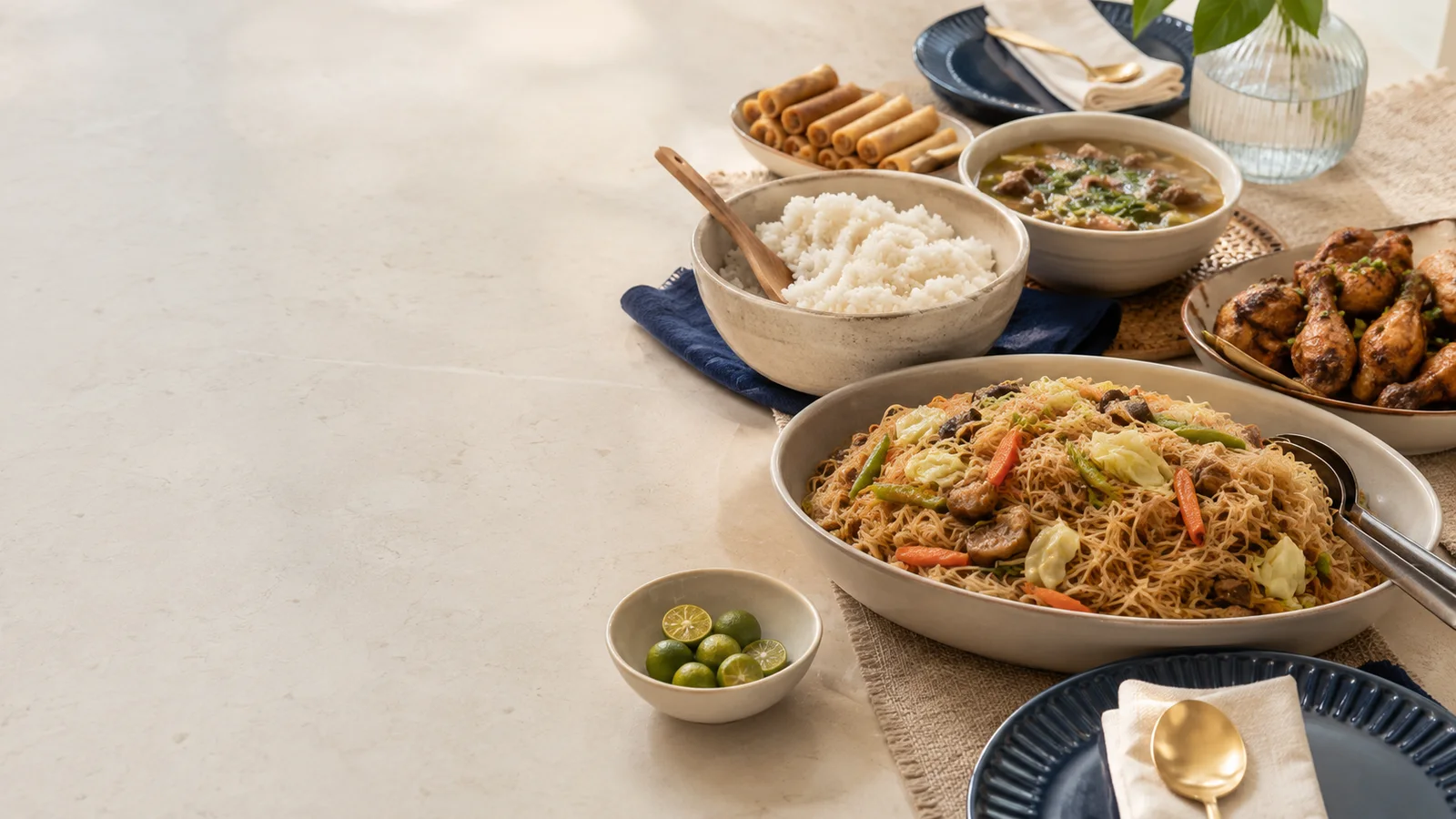 Pancit served with rice, appetizers and Filipino viands for menu planning